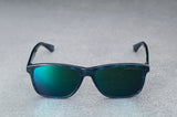dark blue sunglasses with reflective green lenses, open, facing forward.